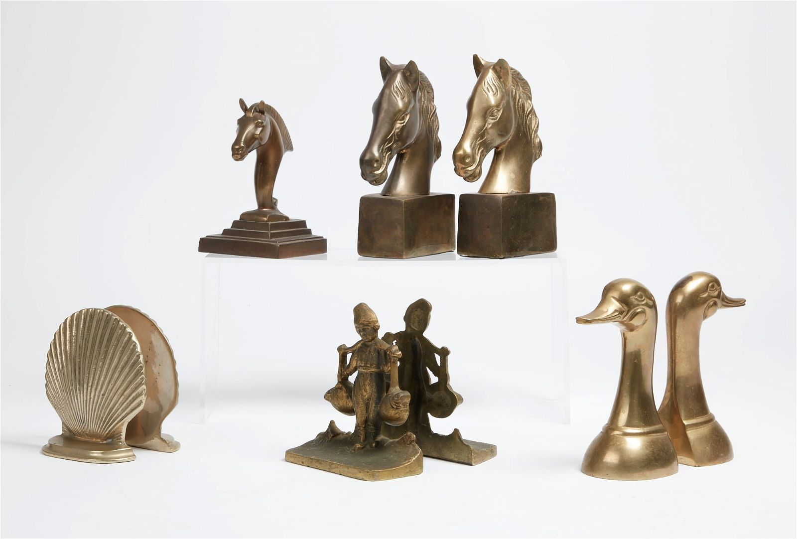 FOUR PAIRS OF BRASS BOOKENDSFour