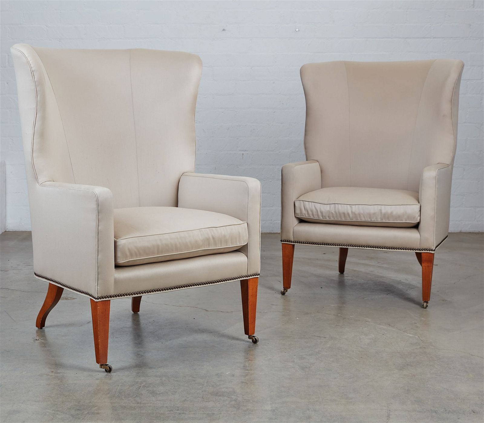 A PAIR OF BAKER CREME UPHOLSTERED