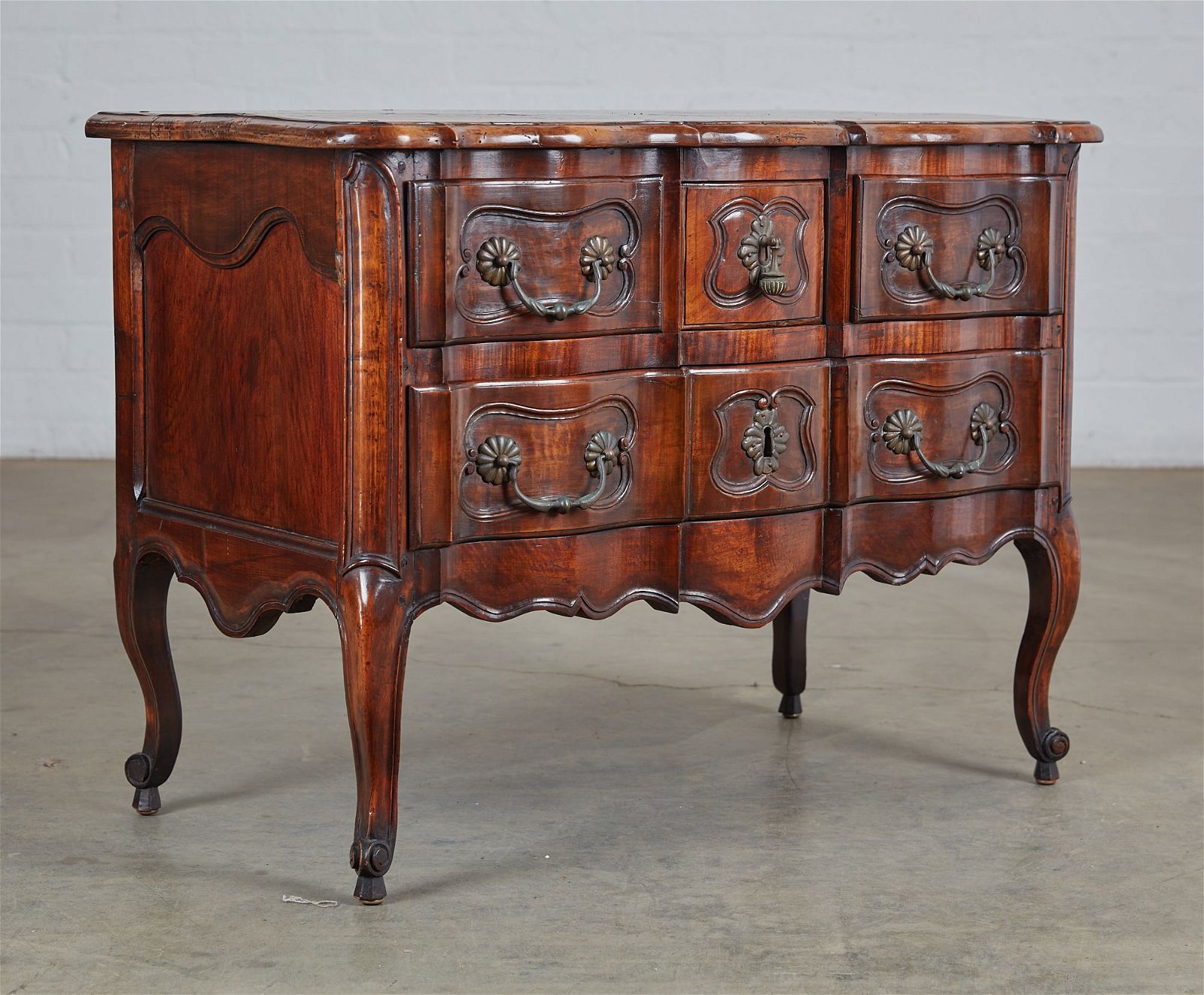 A LOUIS XV STYLE WALNUT COMMODEA