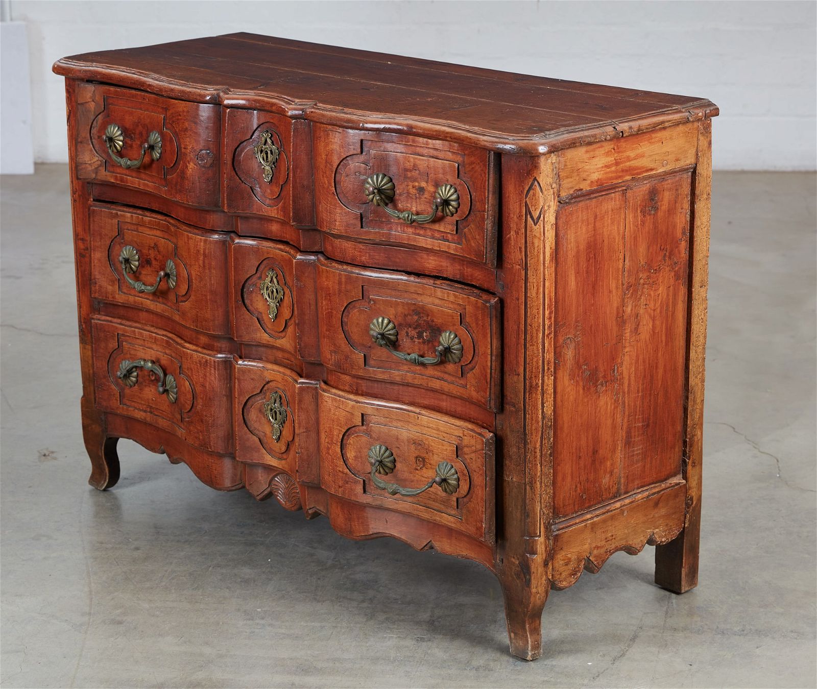 A LOUIS XV WALNUT COMMODE, LATE