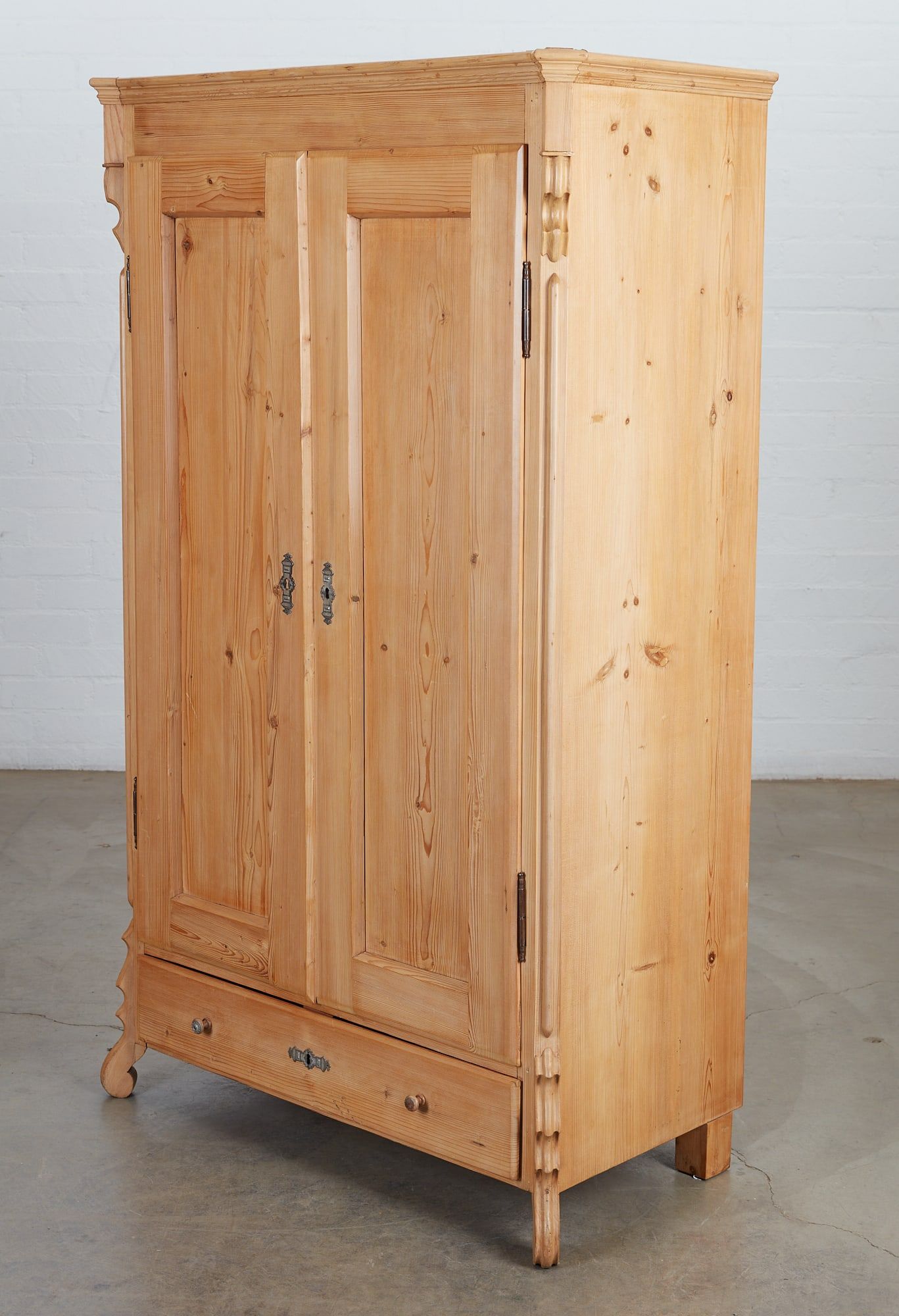 A CONTINENTAL PINE ARMOIRE, LATE