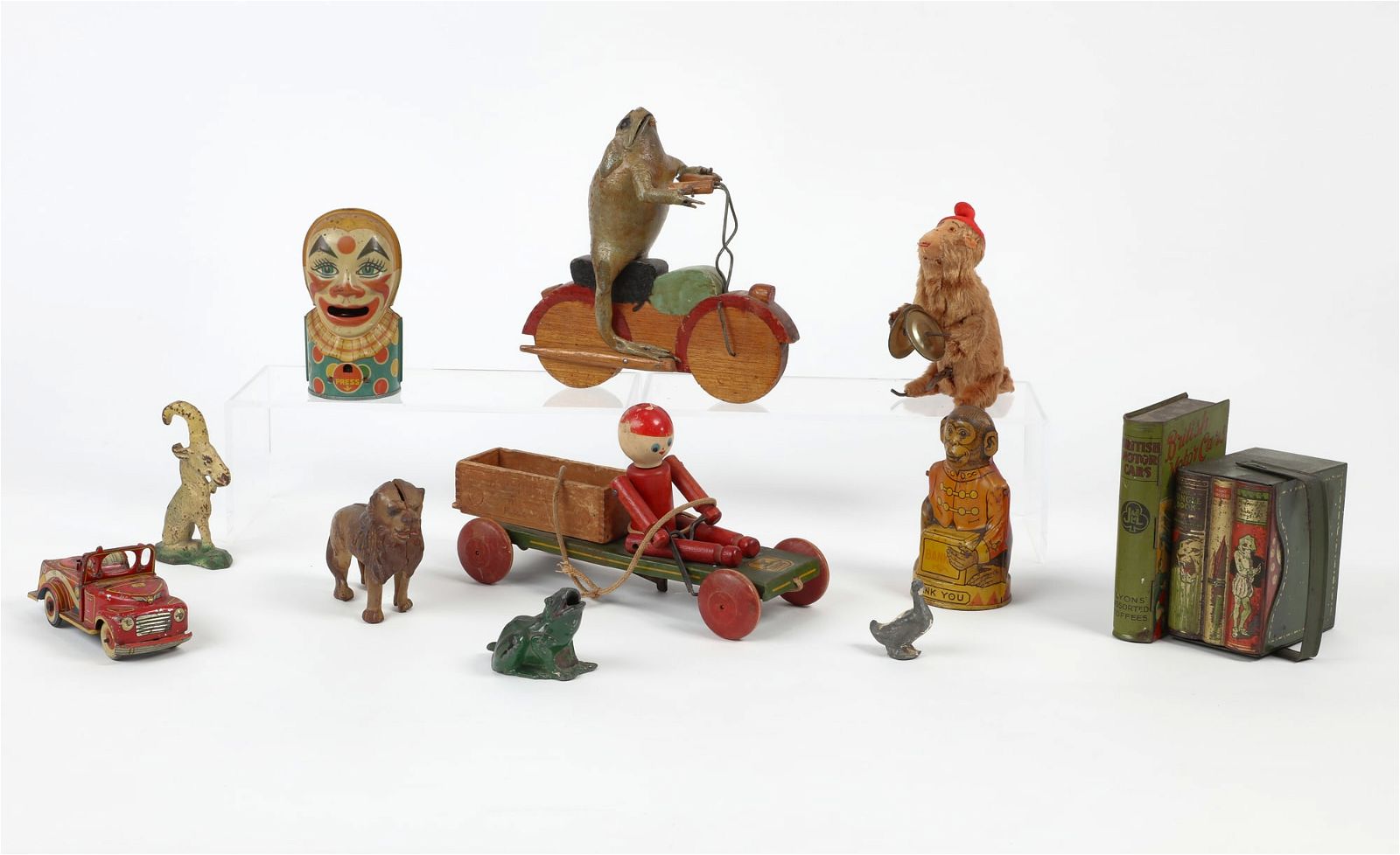 TWELVE ANTIQUE AND VINTAGE TOYSTwelve