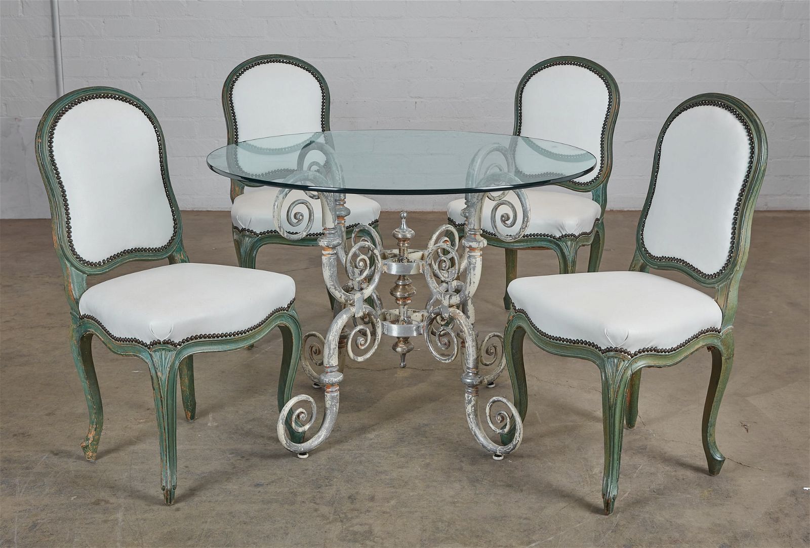 A WROUGHT IRON AND GLASS CENTER TABLEA