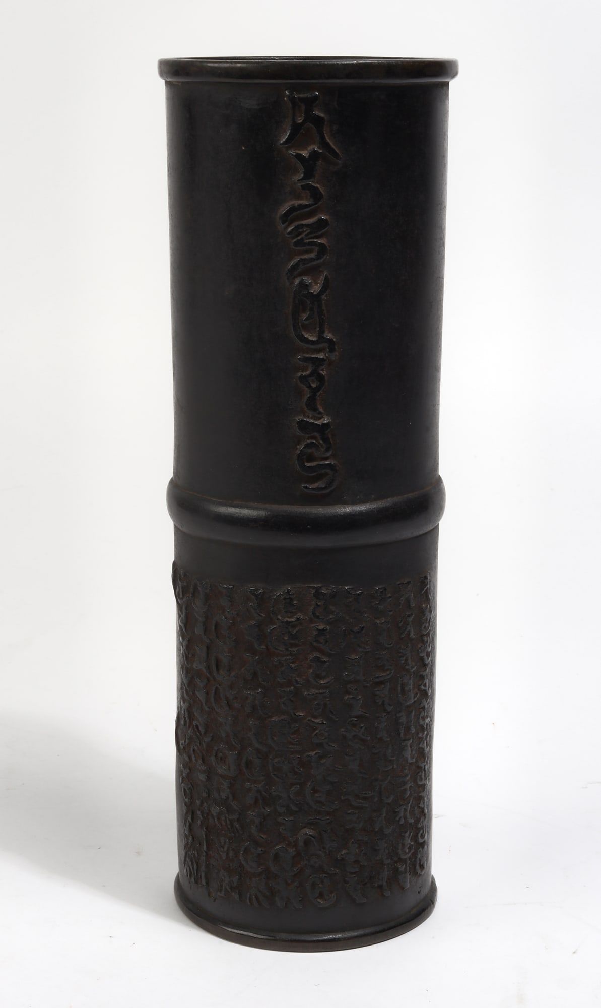 AN ASIAN PATINATED BRONZE CYLINDRICAL