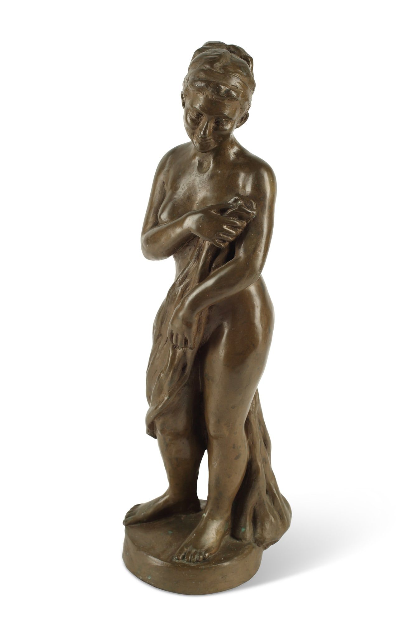 A PATINATED BRONZE FIGURE OF A