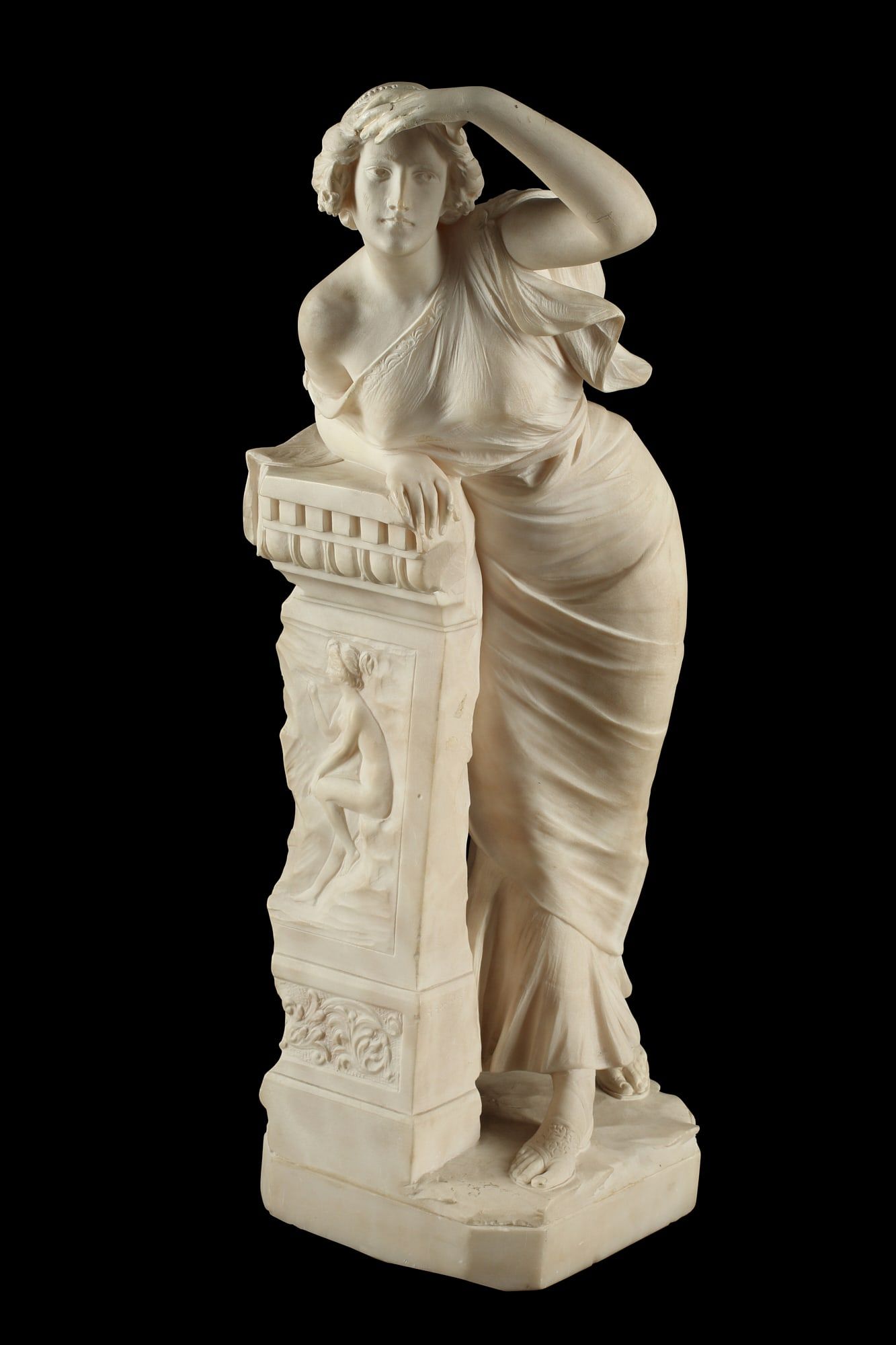 AN ITALIAN CARVED ALABASTER FIGURE