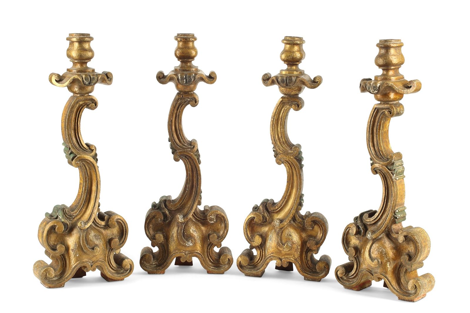 A SET OF FOUR BAROQUE STYLE CANDLESTICKSA