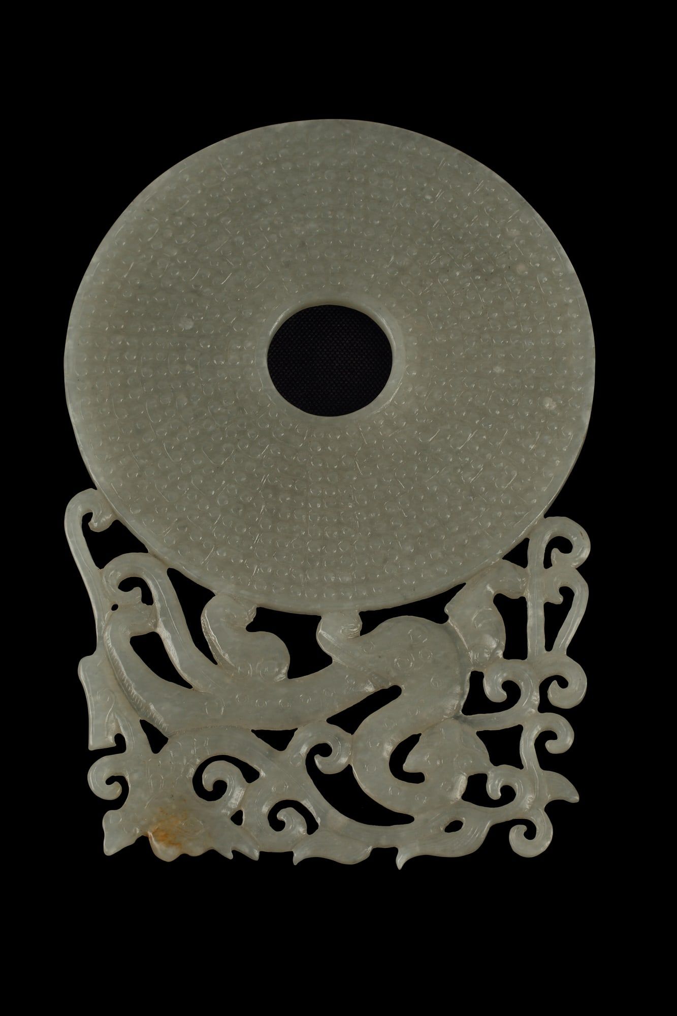 A CHINESE CARVED JADE BI DISKA