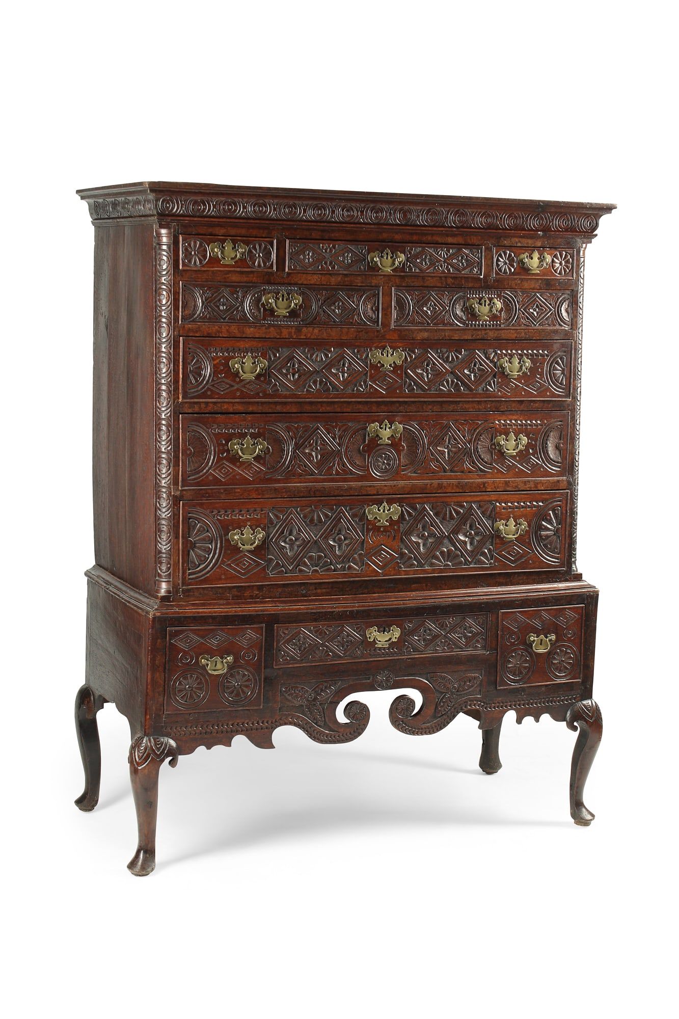 A GEORGE III CARVED OAK CHEST ON