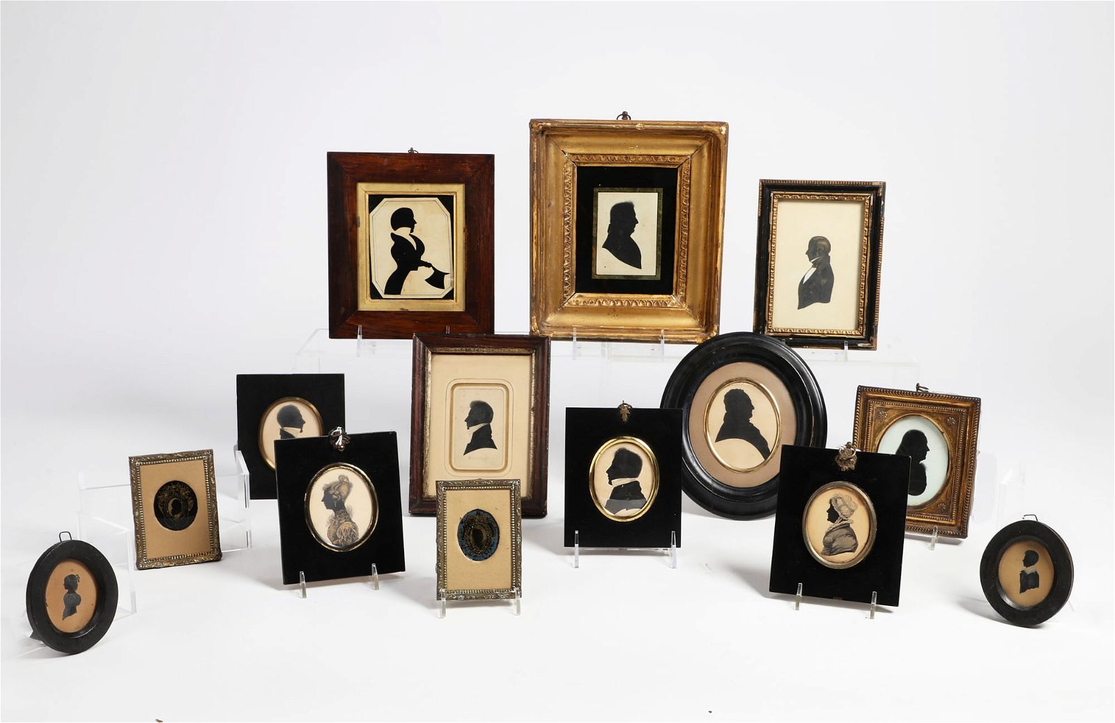 A GROUP OF FOURTEEN SILHOUETTES