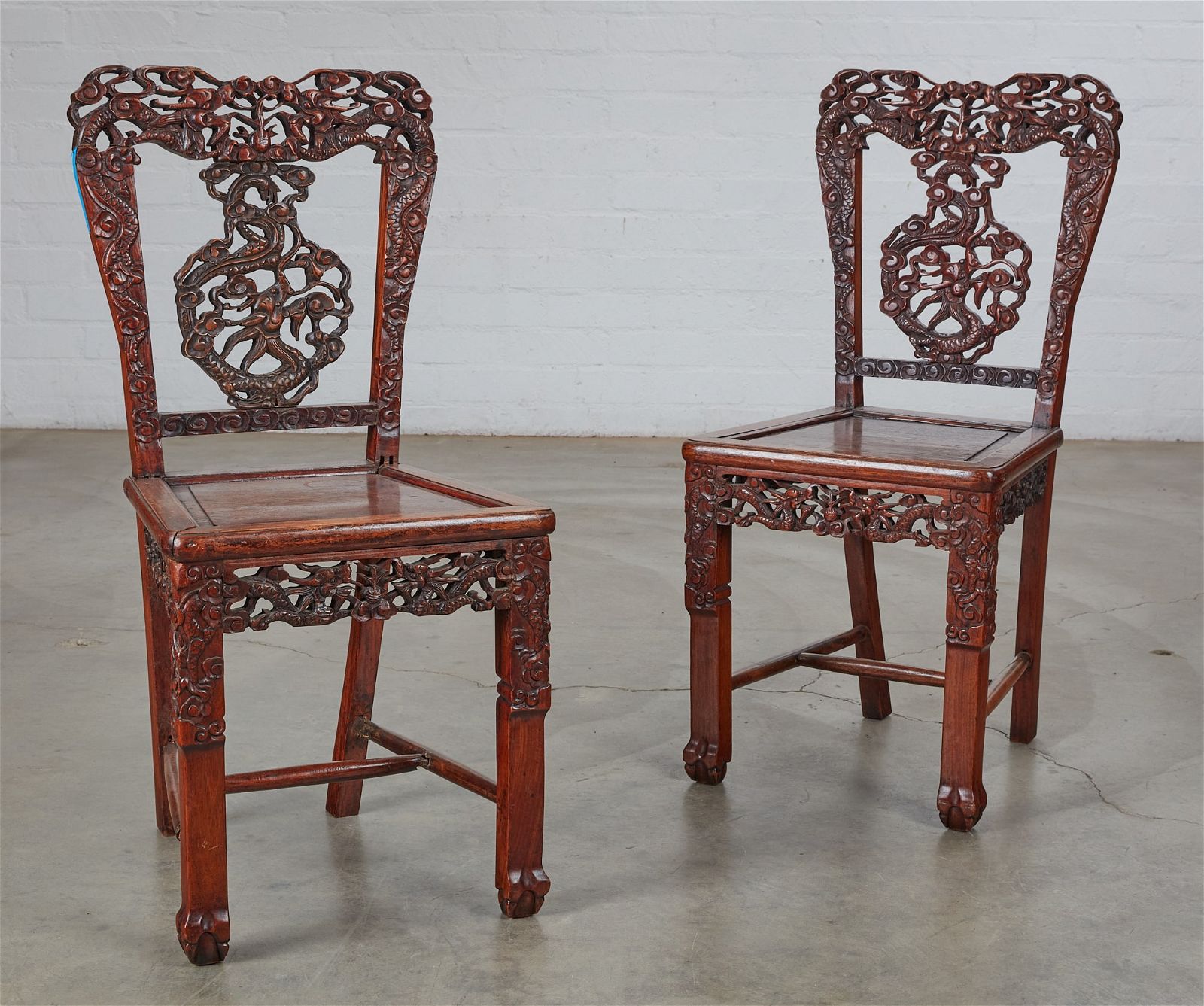 A PAIR OF ASIAN CARVED HARDWOOD