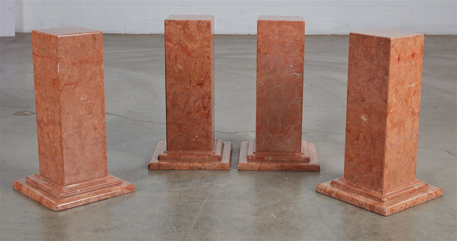 A SET OF FOUR ROSE MARBLE SQUARE