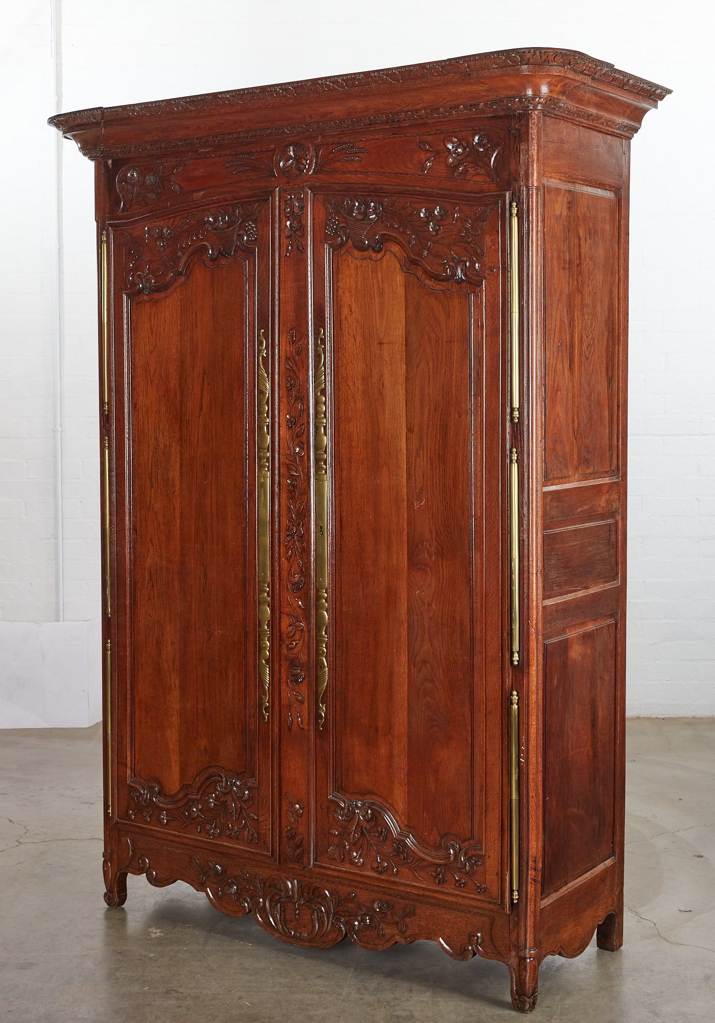 A FRENCH PROVINCIAL CARVED WALNUT
