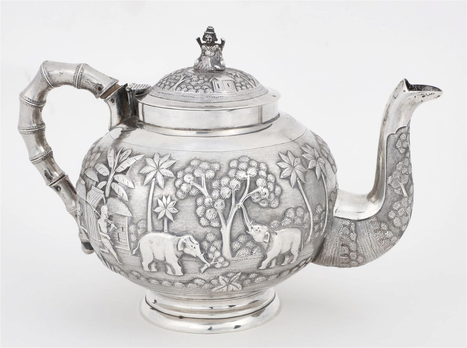 AN INDIAN COLONIAL SILVER TEAPOTAn