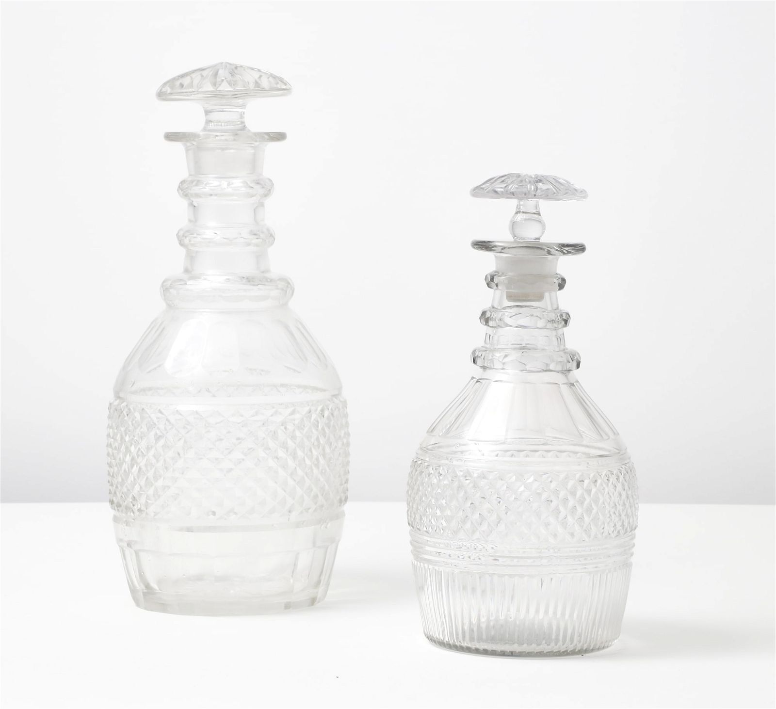 TWO GEORGE III GLASS DECANTERS