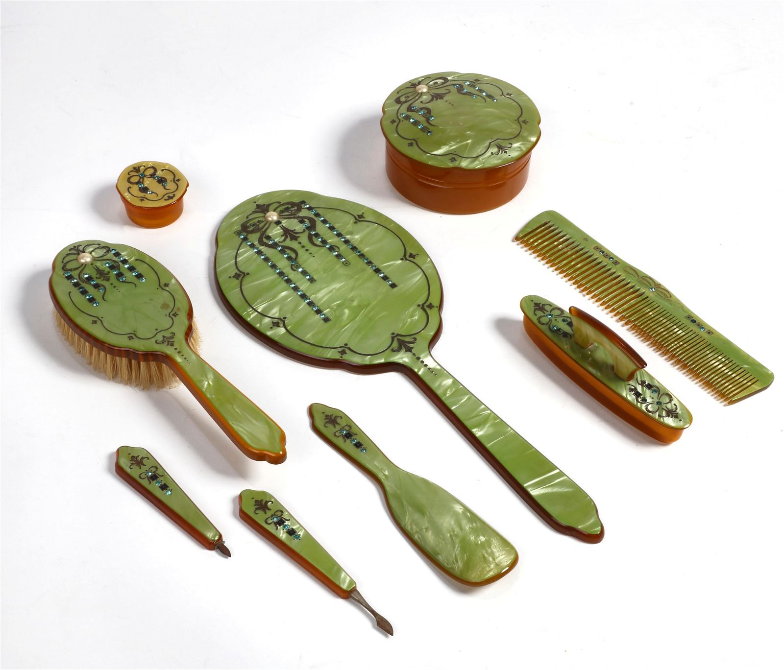 A VINTAGE GREEN CELLULOID DRESSING