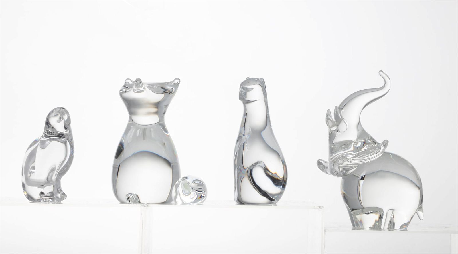 A GROUP OF FOUR CLEAR GLASS ANIMALS,