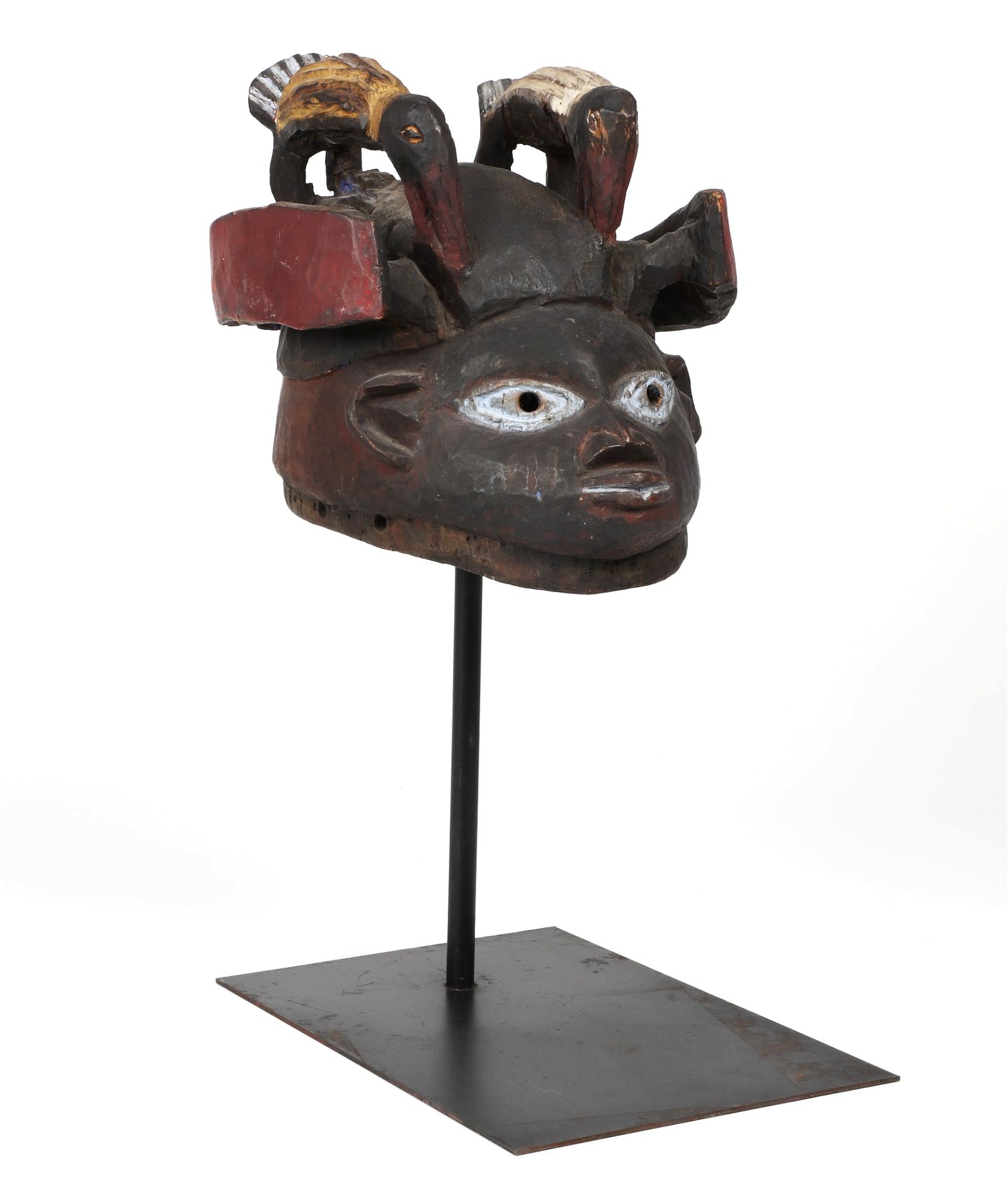 AN AFRICAN TRIBAL CARVED WOOD MASKAn