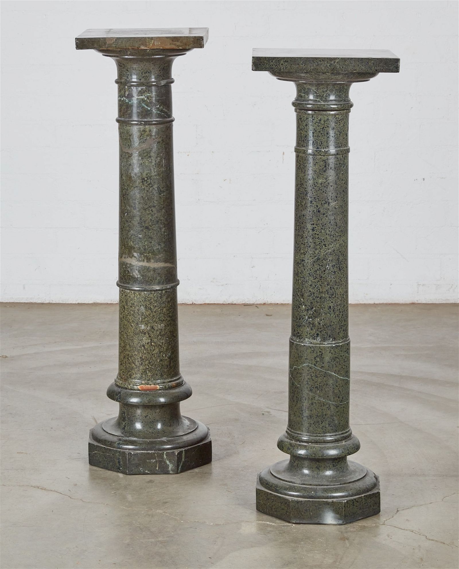 TWO SERPENTINE PEDESTALS WITH REVOLVING