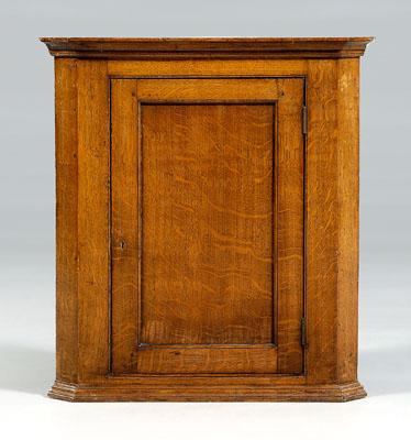 Georgian oak hanging corner cupboard,