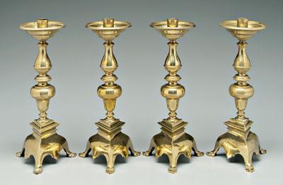 Set of four cast brass candlesticks: