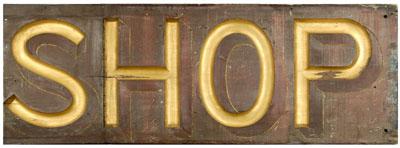 Red-painted and gilt shop sign,