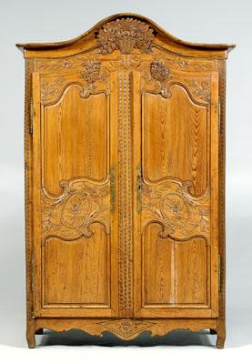 French Provincial carved pine armoire,