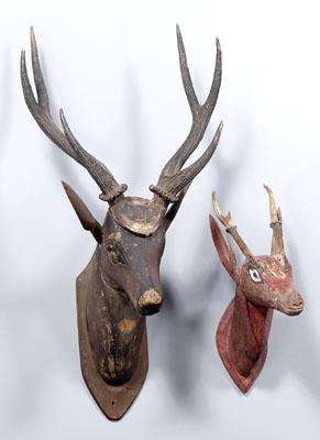 Two folk art deer heads carved 90e18