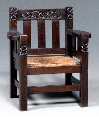 Arts and Crafts carved oak armchair,