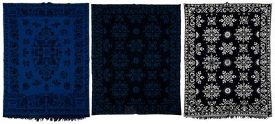 Three jacquard coverlets: one black