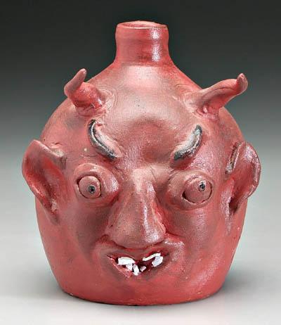 Louis Brown devil jug, broken china