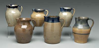 Six Hilton pottery pitchers: five with