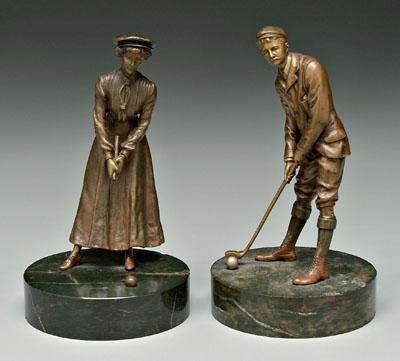 Two golf bronzes: male and female