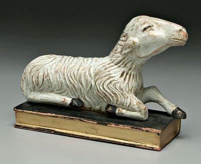 Carved and painted sheep, recumbent