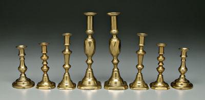 Four pairs brass candlesticks  91afb