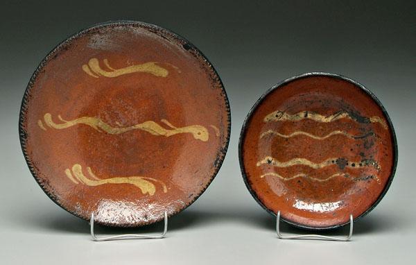 Two redware bowls: both with slip