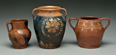 Three earthenware vessels: urn with