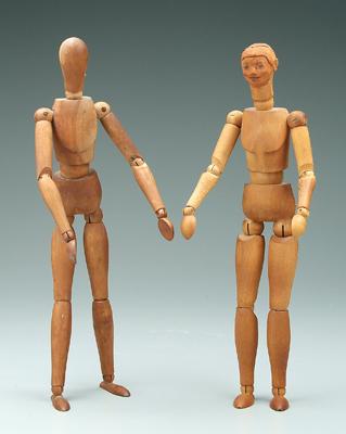 Two wooden artist models: jointed hands,