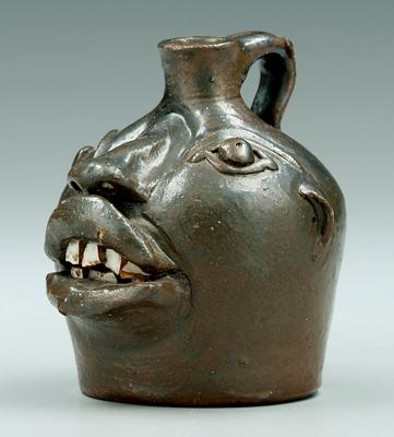 Brown Pottery miniature face jug,