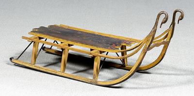 Painted wood and iron gooseneck sled,