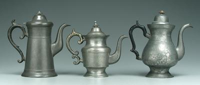 Three pewter teapots: one marked