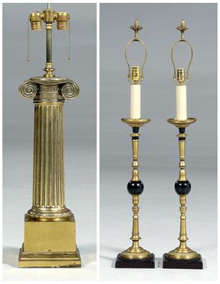 Three modern brass lamps: one tapered