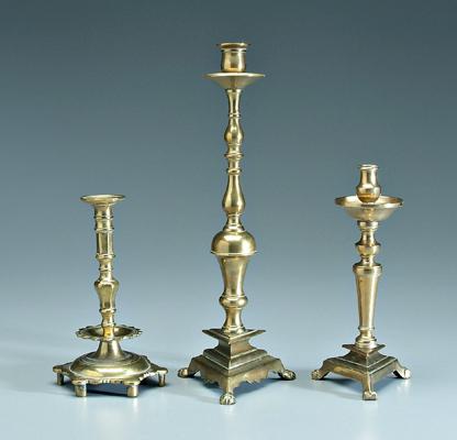 Three footed brass candlesticks: