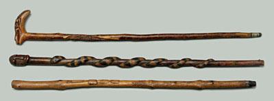 Three folk art canes: one with carved