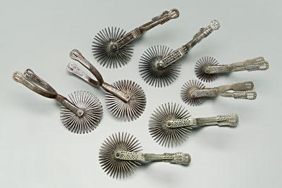 Four pairs decorated gaucho spurs: