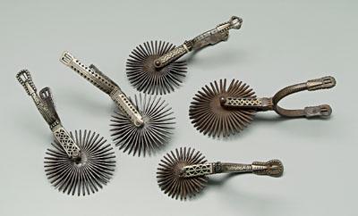 Group of five inlaid gaucho spurs: