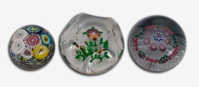 Three floral paperweights: one