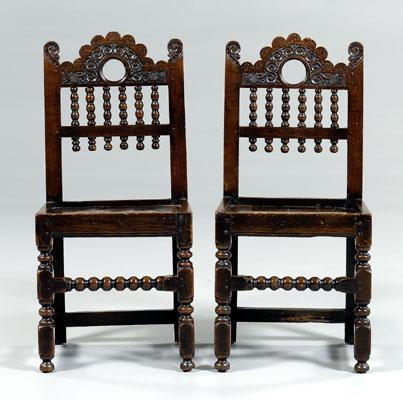 Pair Cromwellian carved oak chairs: