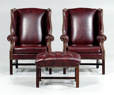 Pair leather wing chairs, ottoman: