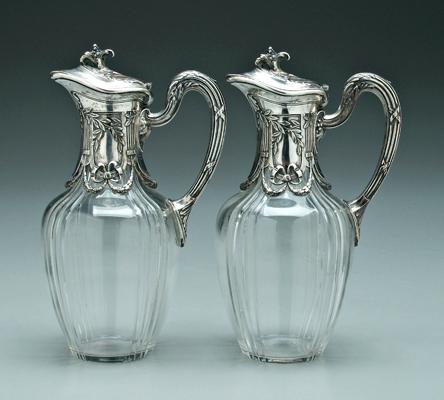 Pair glass and silver claret jugs: round